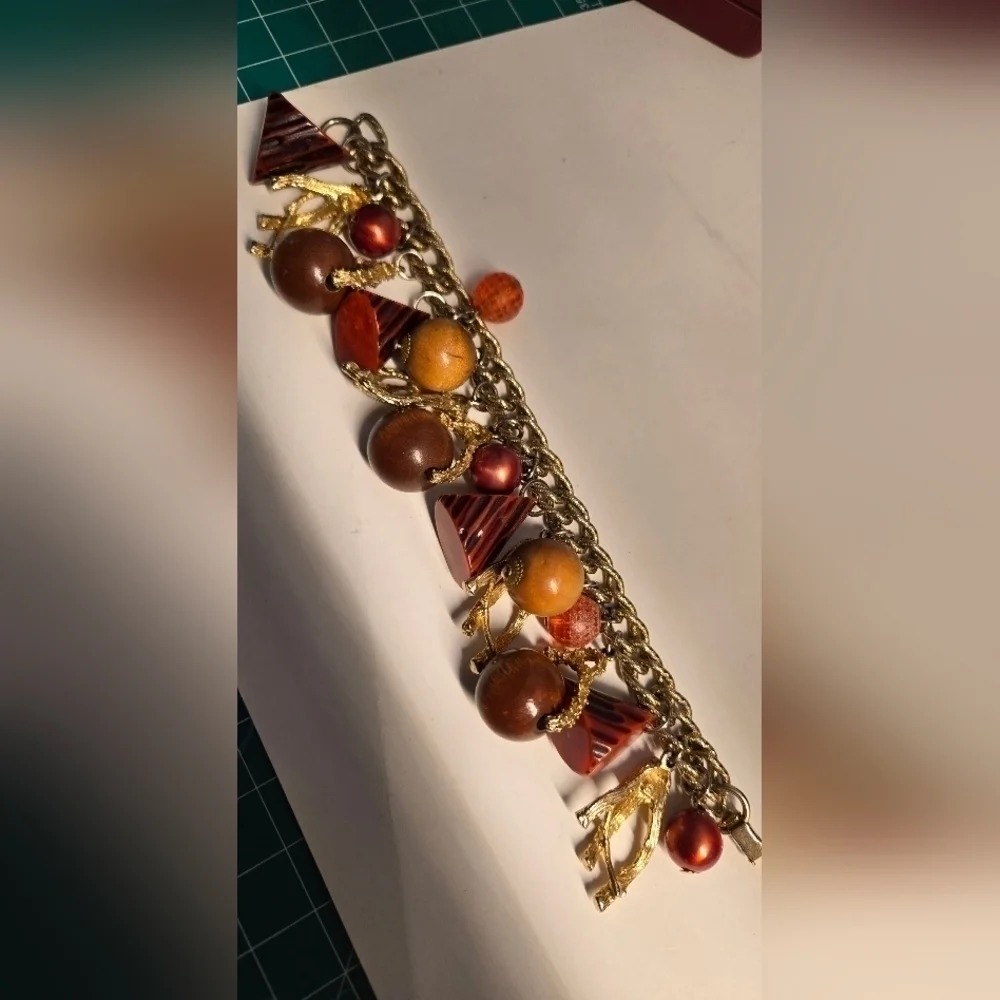 Bakelite gold tone charm bracelet